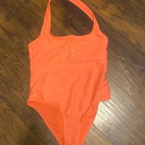 One peice swim suit open back halter top worn once.size medium.